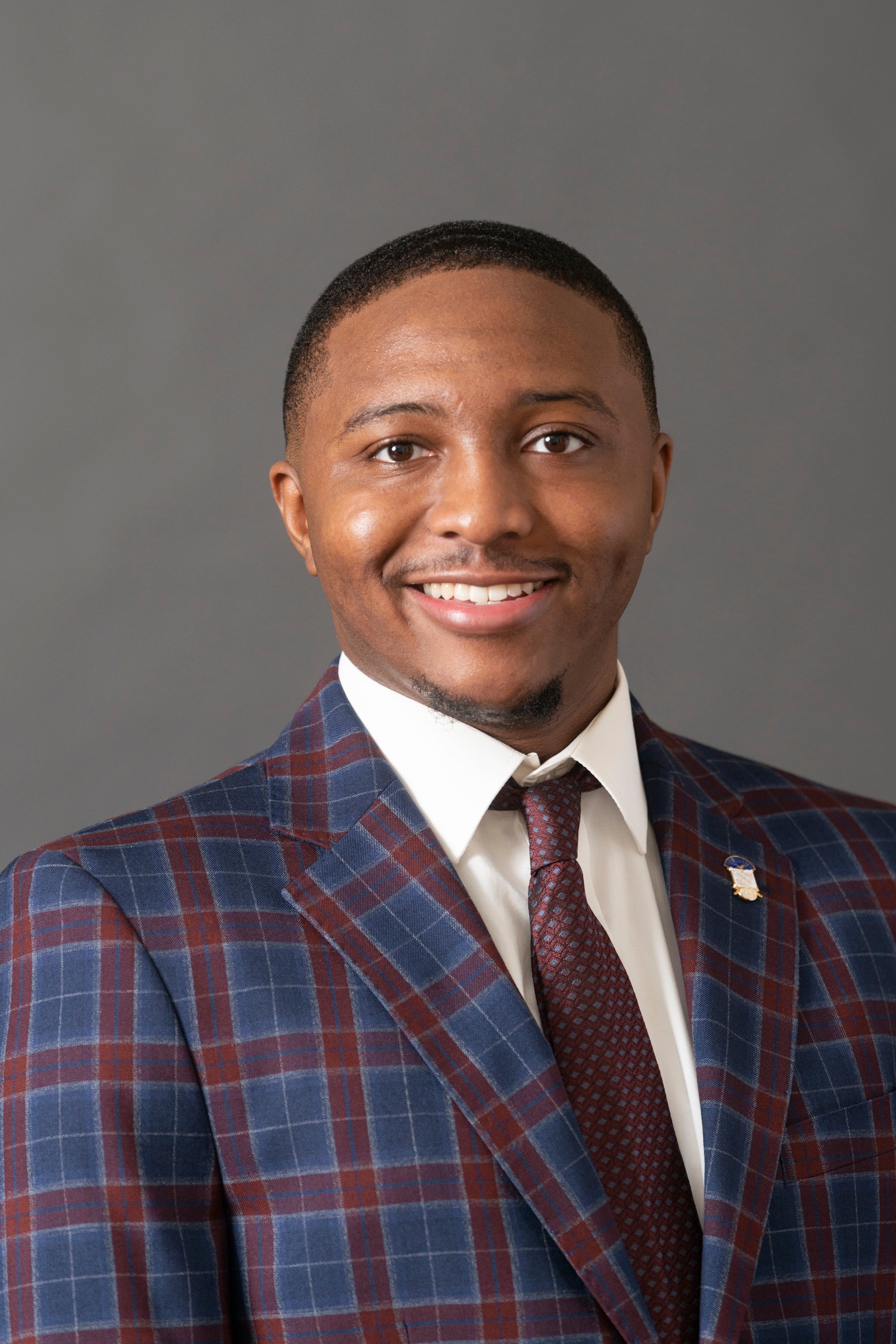 Headshot of Timmy Bridgeman on gray background