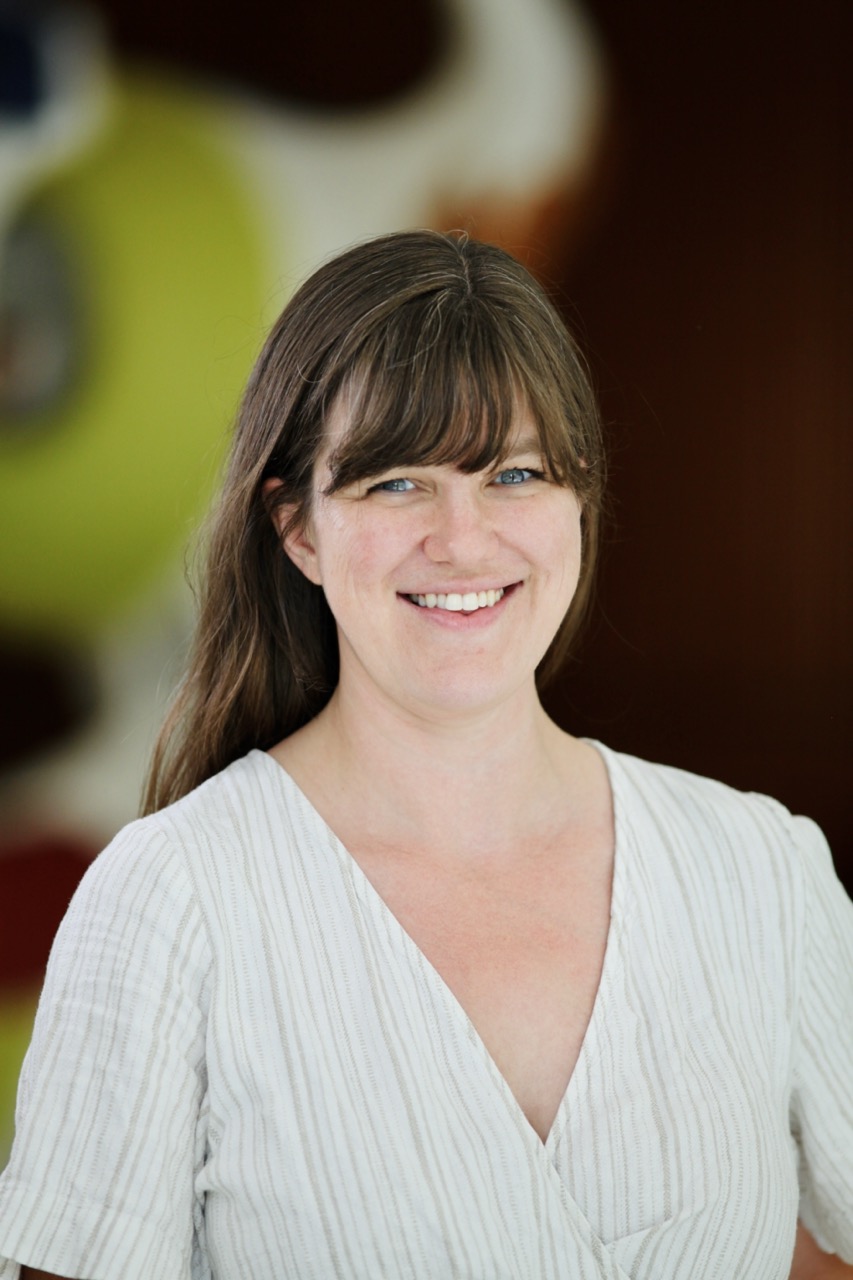 Photo of woman with brown hair on blurred background